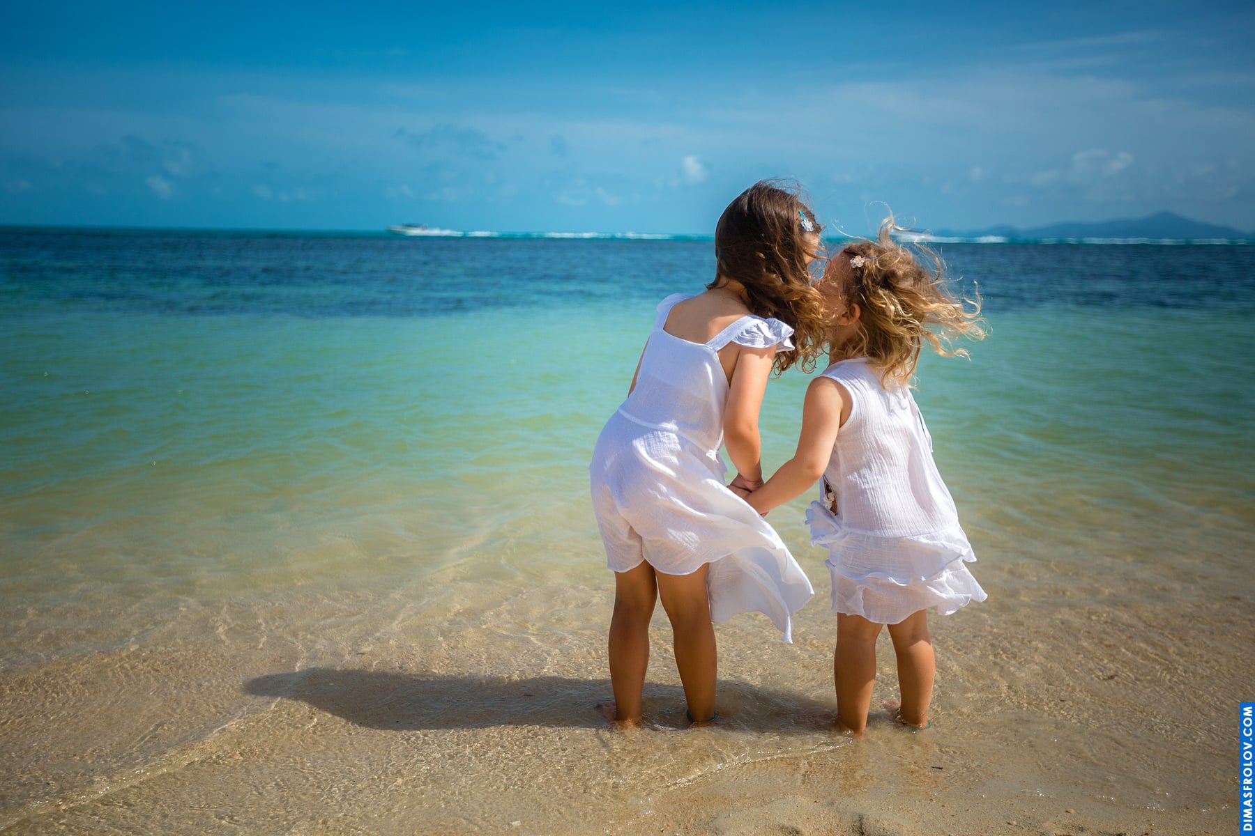 Mother and daughter beach photo shoot in shallow water — sweet and carefree moment