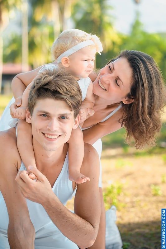 Outdoor family portrait with young parents and baby — happy lifestyle photo session
